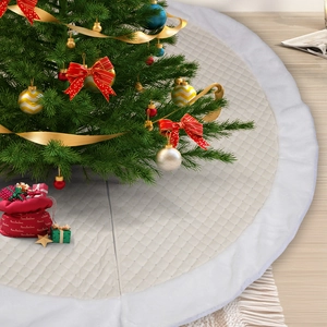 Quilted cream Christmas tree skirt with white plush trim and festive gift bag accessory