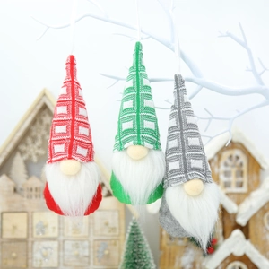 Detailed view of handmade plush Christmas gnomes with knit hats and white faux fur beards
