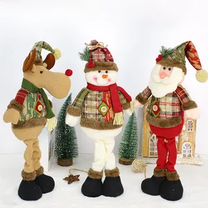 Detailed close-up of Christmas plush dolls with reindeer and snowman festive designs