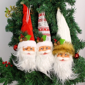 Three-piece Santa Claus ornaments with velvet and knit textures hanging on a Christmas tree