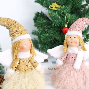 Detail of Christmas angel dolls with sequin hats and fluffy feather skirts for holiday decor