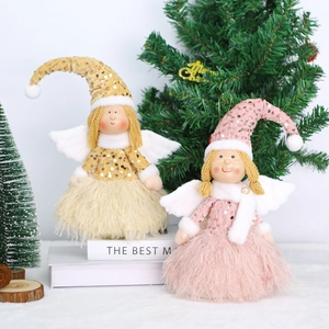 Detailed view of plush Christmas angel dolls with sequin wings and feather skirts