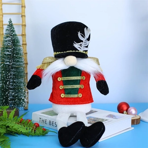 Close-up of festive Christmas nutcracker gnome plush with red and green uniform details