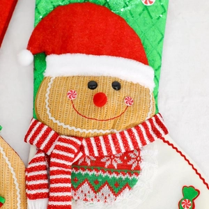 Christmas gingerbread man stocking with sequin green fabric and knit scarf ornament