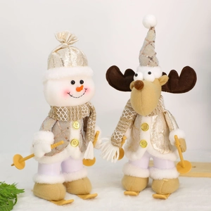 Plush Christmas dolls set featuring snowman and reindeer skiing in gold sequin outfits