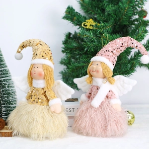 Christmas angel dolls with sequin hats and feather wings in a festive holiday setting
