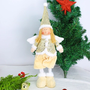 Detail of Christmas angel doll with sparkling gold sequins and soft white plush wings