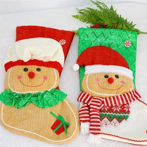 Christmas gingerbread man stockings with red and green knitting and plush trim hanging decor