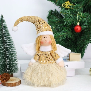 Detailed close-up of a Christmas angel doll with gold sequins and soft cream plush skirt