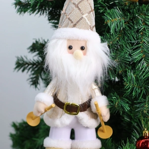Detail of plush Christmas skiing figurine with golden sequins and white faux fur texture