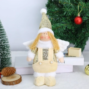 Detail of Christmas angel plush doll with gold sequins and soft faux fur textures