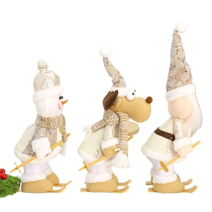 Three Christmas ski dolls featuring a snowman, elk, and Santa in champagne plush outfits
