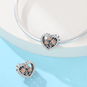 Detailed silver sunflower heart charm with amber gemstone and white zircon setting