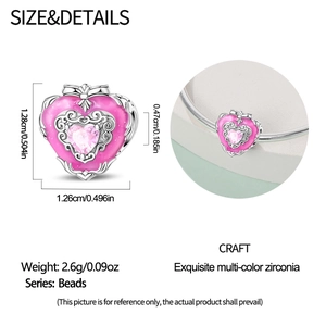 Detail of pink enamel heart charm bead with zircon inlay for DIY charm bracelets