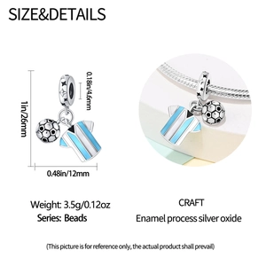 Macro view of soccer ball and jersey charm with dimensions 26mm and 3.5g weight details