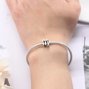 Silver snake chain bracelet featuring a Virgo zodiac charm with a gold star detail