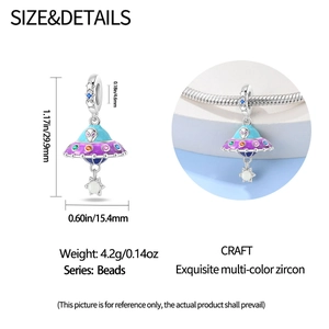 Detailed view of luminous UFO space charm with multi-color zircon and enamel in 925 silver