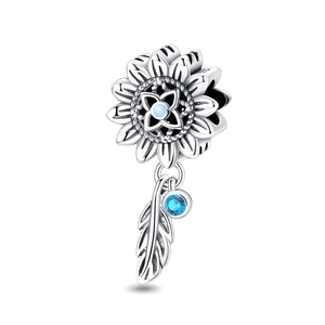 Detail of silver sunflower charm with blue stones and delicate feather pendant