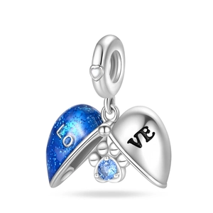 Detail of silver heart locket with blue enamel and crystal cat paw charm