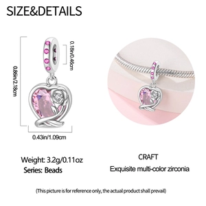 Detail of silver heart charm with pink zircon and rose engraving for DIY bracelets