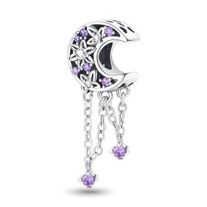 Macro detail of crescent moon charm with purple zircon stones and floral engraving