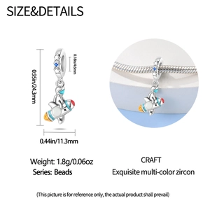 Detailed view of astronaut charm with blue star zircon and enamel for DIY bracelets