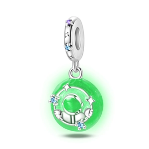 Macro view of astronaut charm with green glowing bead and silver star details