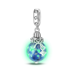 Detailed view of silver globe charm with glowing blue-green bead and bow pendant