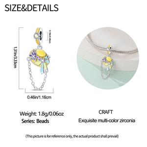 Detailed view of silver sun hat charm with colorful enamel flowers and hanging chains