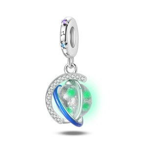Detailed view of glow-in-the-dark planet charm with blue enamel and sparkling star crystals