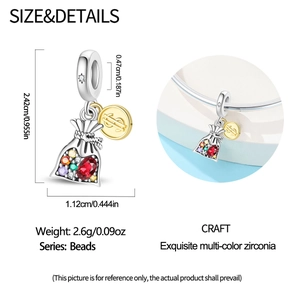 Detailed specs of money bag charm with colorful zirconia and dollar sign coin pendant