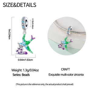 Detail view of colorful enamel hummingbird charm size dimensions and on-wrist bracelet look