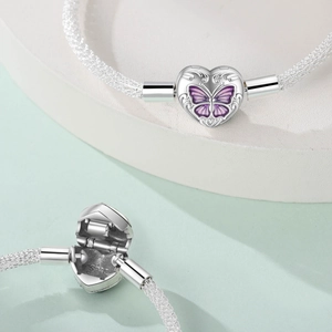 Silver mesh bracelet featuring a heart-shaped purple butterfly clasp and S925 stamp
