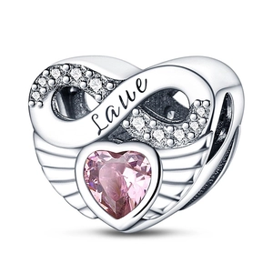 Macro detail of infinity heart charm with pink crystal and Love engraving on silver
