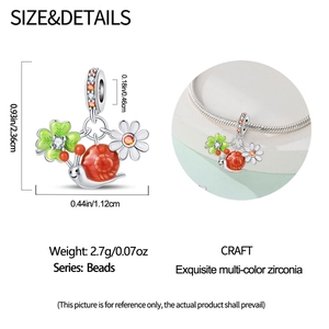 Macro detail of snail charm size and fit for bracelets with colorful enamel and cubic zirconia