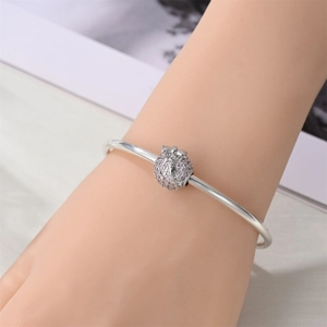 Silver bangle charm featuring pink crystals, a bow detail, and Princess engraving