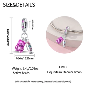 Detail view of silver gummy bear and heart candy charm with S925 engraved ring dimensions