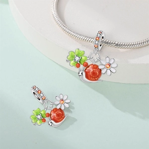 Silver snail and clover charm bead with orange enamel and green clover on snake chain