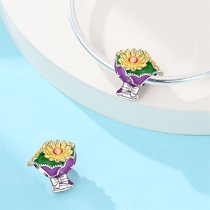 Detail of sunflower bouquet charm with enamel petals and a sparkling zircon center