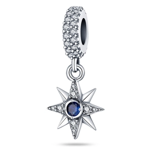Detailed view of silver star charm with blue stone and pavé cubic zirconia