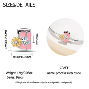 Detailed view of silver sunflower charm bead with pink enamel and sparkling rhinestones