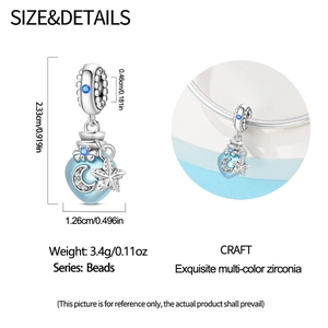Detailed view of silver heart charm with blue crescent moon and star cubic zirconia
