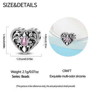 Detail of pink zirconia heart charm with scrollwork design and size specifications