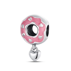 Detail of pink enamel donut charm with silver hearts and small heart pendant
