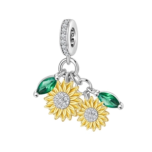 Two-tone sunflower charm bead with gold petals, green zircons and sparkling crystals