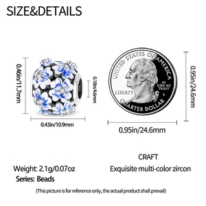 Blue enamel flower charm bead with cubic zirconia stones and coin size comparison