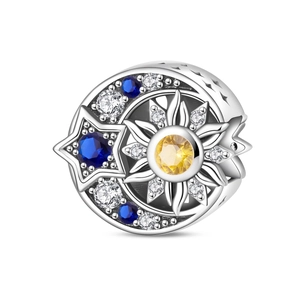 Detailed charm featuring crescent moon, radiant sun, and blue star with sparkling crystals