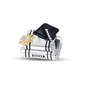 Detail of silver book charm with black mortarboard and gold sunflower for graduation