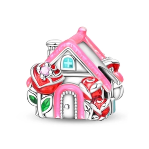 Detail of silver-plated house charm with pink roof and red roses for DIY bracelets