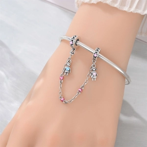 Silver bead bracelet featuring boy and girl charms with pink heart chain detail